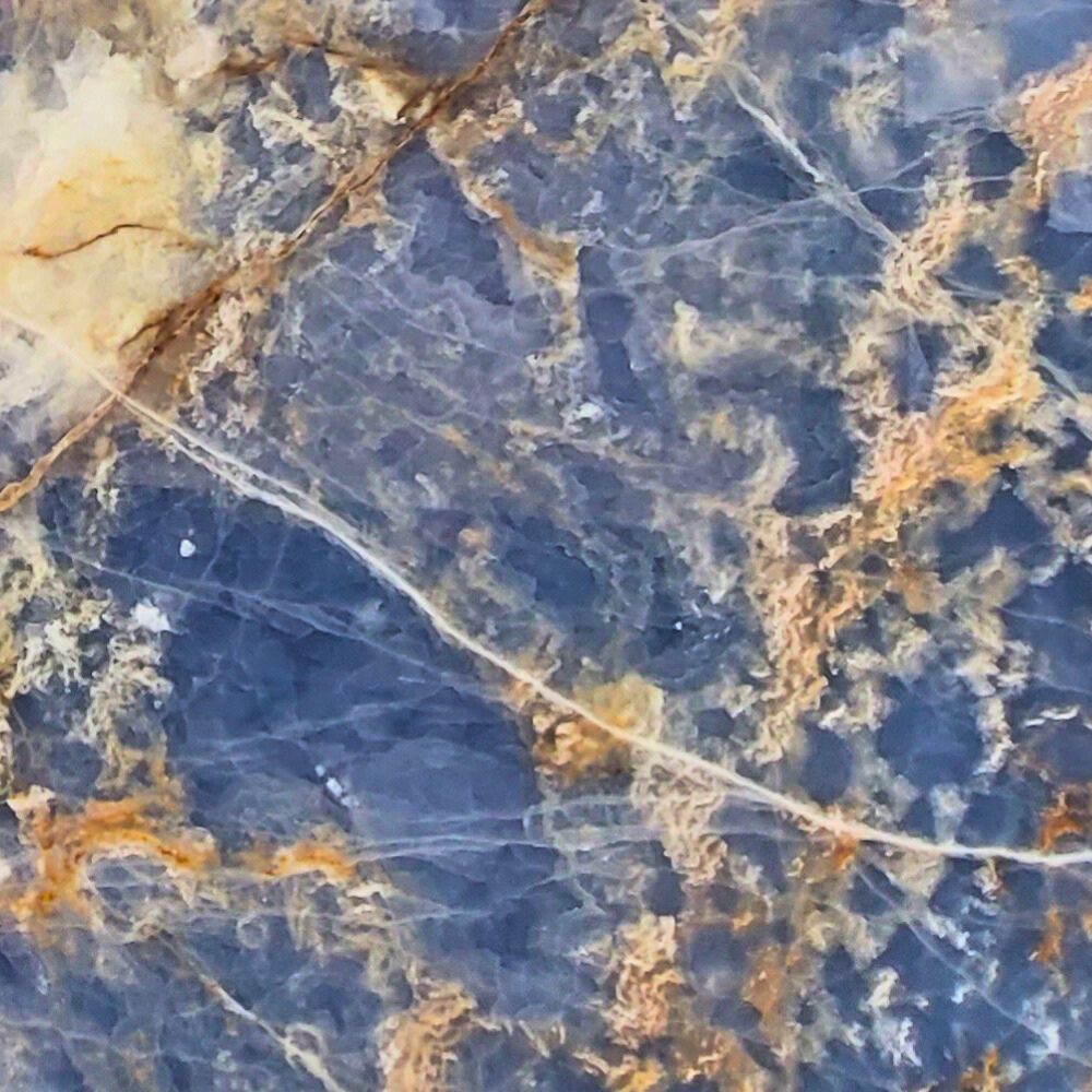 Blue Onyx natural stone with vibrant blue tones and intricate veining, ideal for backlit panels, feature walls, and luxurious countertops.