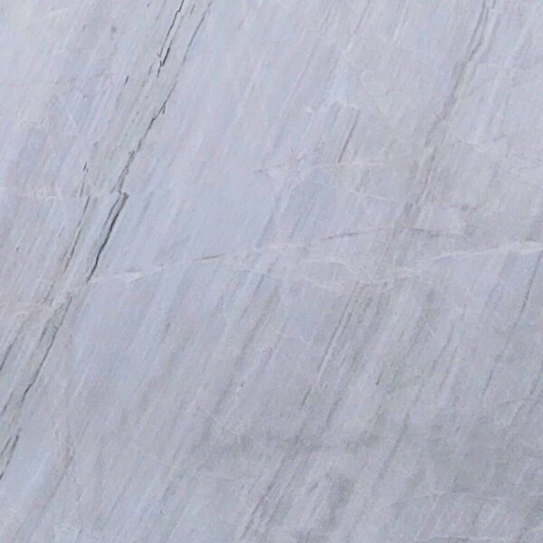 Chini Aligodarz white marble with a pure white background and subtle gray veining, perfect for flooring, wall cladding, and countertops.