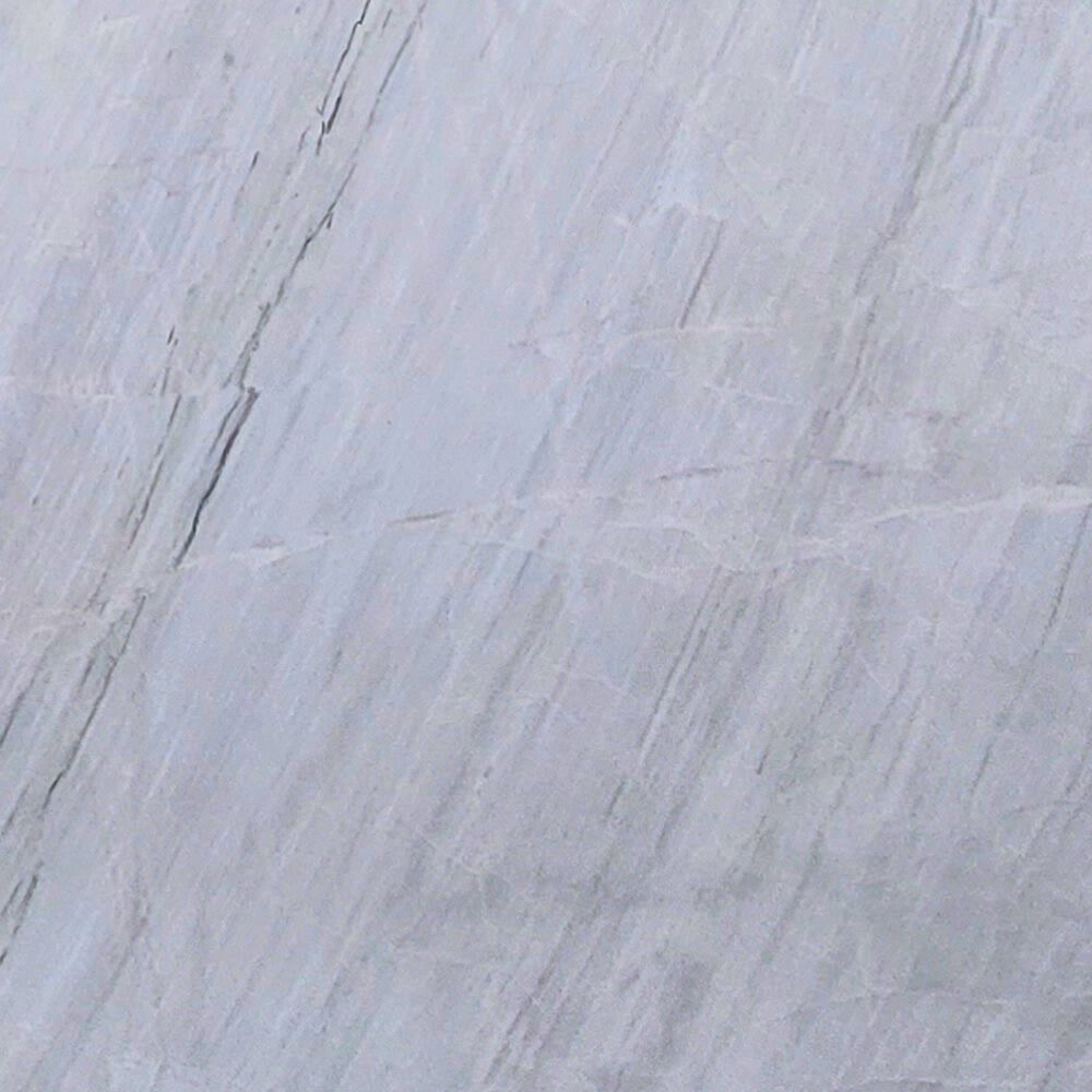 Chini Aligodarz white marble with a pure white background and subtle gray veining, perfect for flooring, wall cladding, and countertops.
