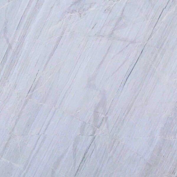 Chini Aligodarz white marble with a pure white background and subtle gray veining, perfect for flooring, wall cladding, and countertops.