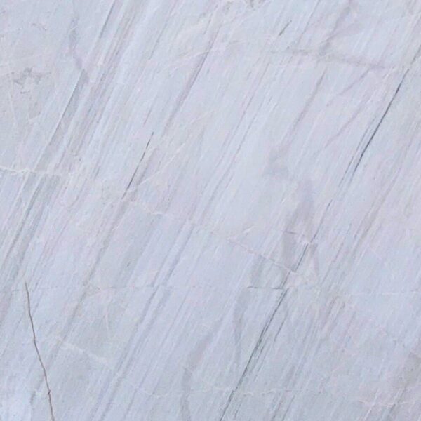 Chini Aligodarz white marble with a pure white background and subtle gray veining, perfect for flooring, wall cladding, and countertops.