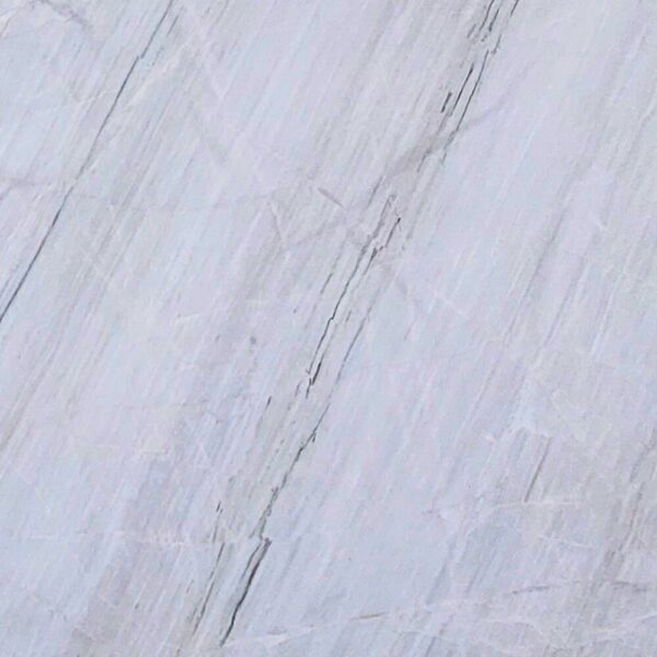 Chini Aligodarz white marble with a pure white background and subtle gray veining, perfect for flooring, wall cladding, and countertops.