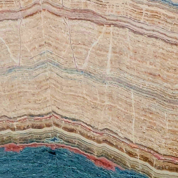 Travertine Seven Color natural stone with a blend of red, beige, brown, gray, and gold tones, perfect for flooring, wall cladding, and outdoor applications.