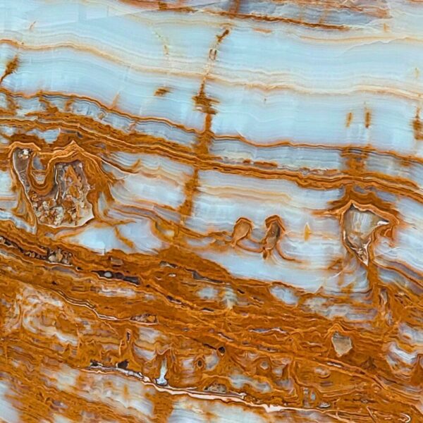 Tree Onyx natural stone with earthy tones and organic veining patterns, ideal for backlit panels, feature walls, and decorative applications.