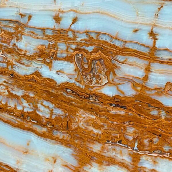 Tree Onyx natural stone with earthy tones and organic veining patterns, ideal for backlit panels, feature walls, and decorative applications.
