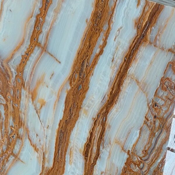 Tree Onyx natural stone with earthy tones and organic veining patterns, ideal for backlit panels, feature walls, and decorative applications.
