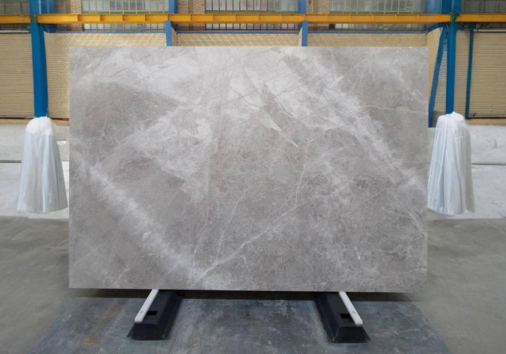 Close-up of Persian Silk Marble slab showing soft cream and beige veins