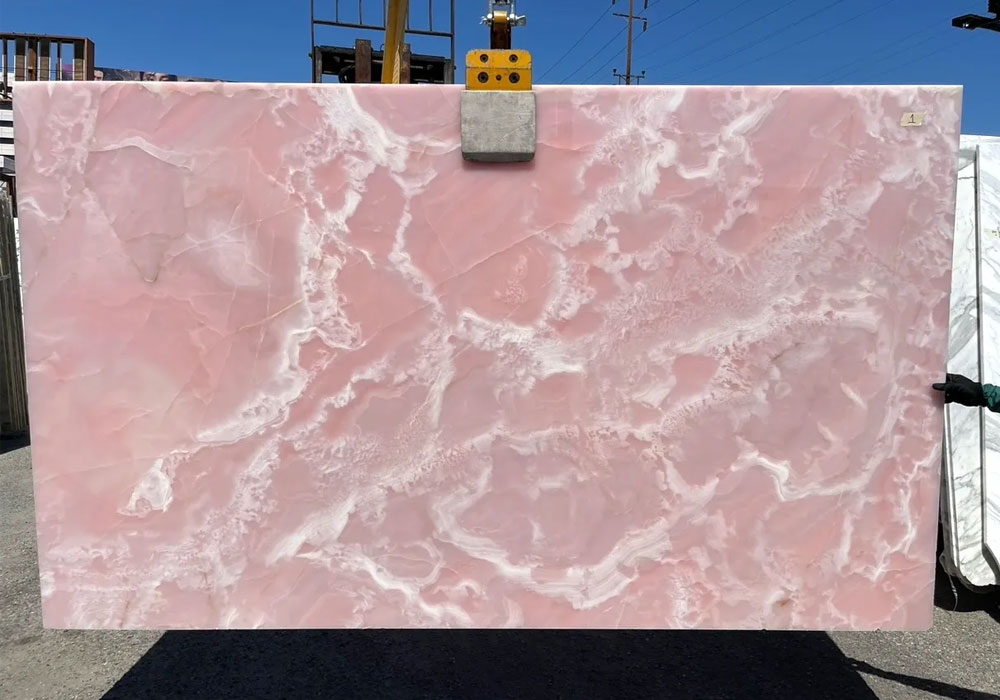 Pink Onyx slab with smooth surface and natural light pink patterns