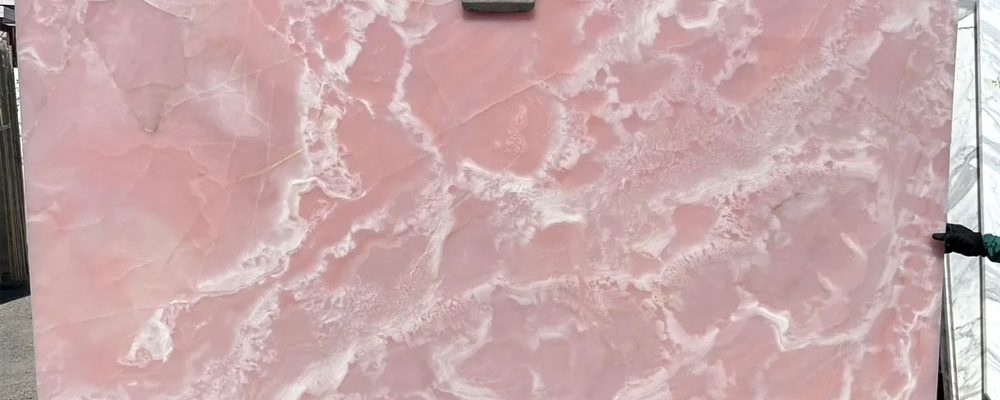 Pink Onyx slab with smooth surface and natural light pink patterns